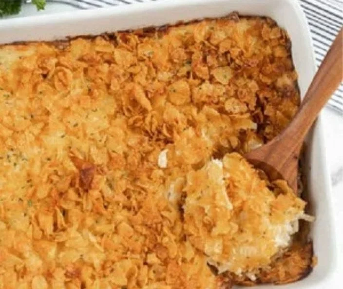 Delicious creamy chicken hashbrown casserole served in a baking dish