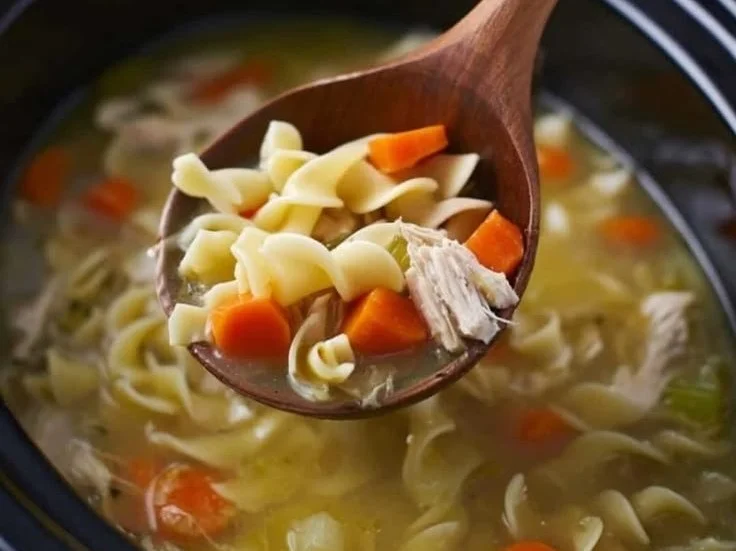 Bowl of easy Crock Pot turkey noodle soup with vegetables and noodles