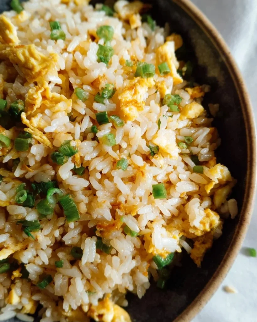Bowl of delicious Egg Fried Rice with vegetables and eggs