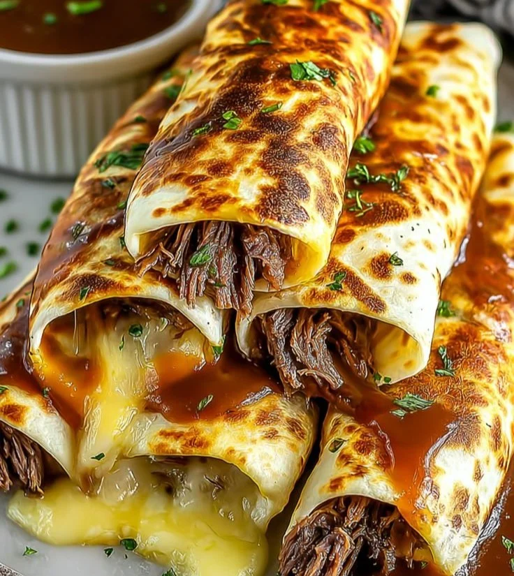 French Dip Tortilla Roll Ups served on a plate, ready to enjoy.