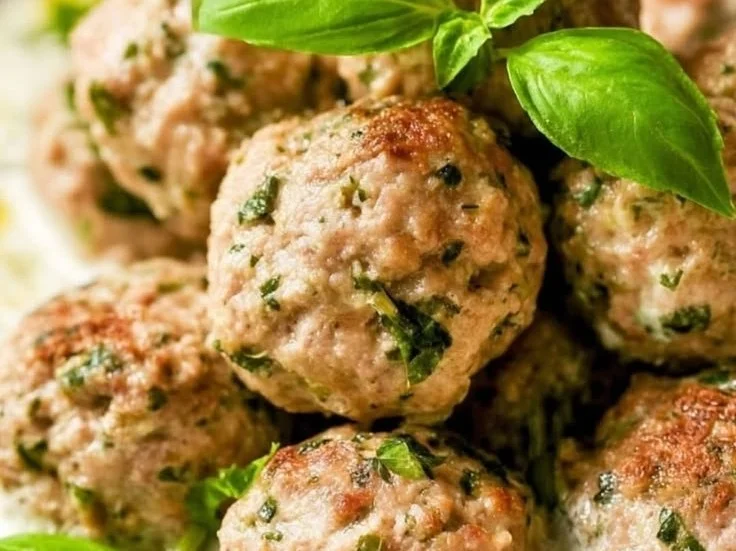 Delicious Greek chicken meatballs served with tzatziki sauce on a plate