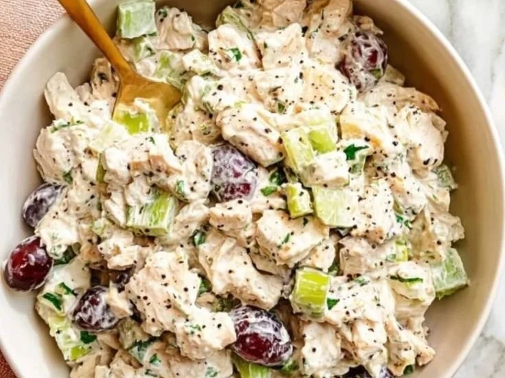Healthy chicken salad with grapes and almonds served in a bowl