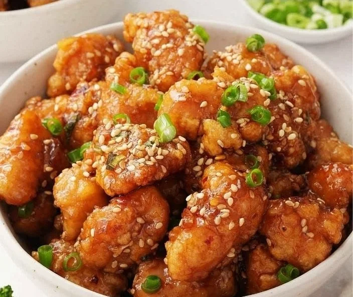 Golden crispy Honey Butter Fried Chicken served with a side of honey drizzle