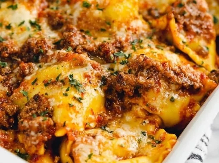 Delicious ravioli lasagna casserole served on a plate, showcasing layers of pasta and cheese.