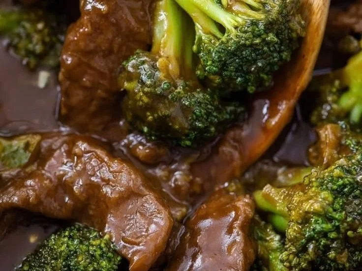 Slow Cooker Beef and Broccoli served in a bowl with rice