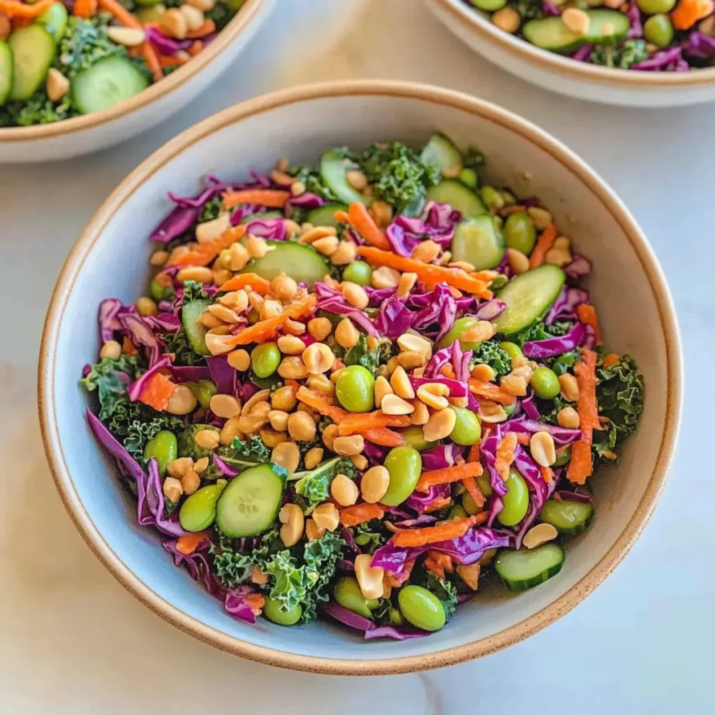 Bowl of zesty edamame crunch salad with fresh vegetables and dressing