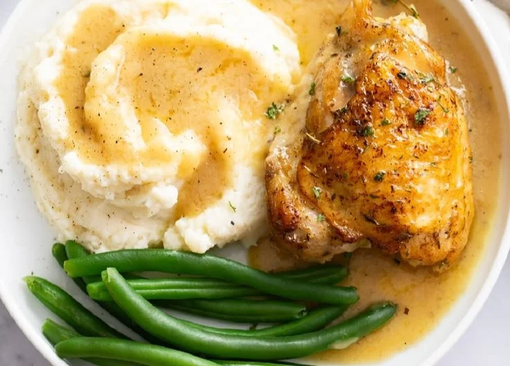 Delicious baked chicken thighs garnished with herbs and spices