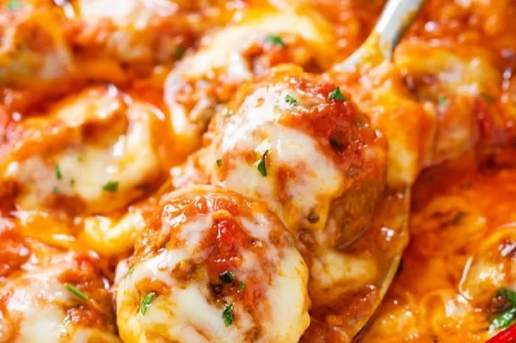 Delicious baked meatballs served with marinara sauce on a plate
