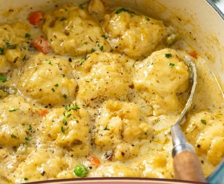 Bowl of Chicken and Dumplings featuring tender chicken and fluffy dumplings