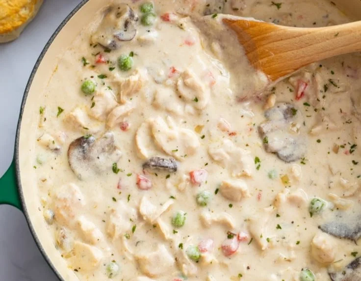 Delicious Chicken in the Style of the King served with vibrant sides