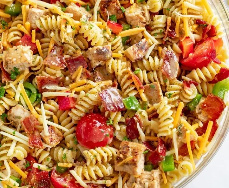 Delicious chicken pasta salad with fresh vegetables and dressing