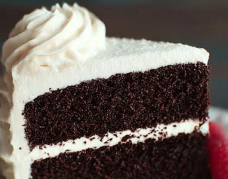 Delicious chocolate cake decorated with smooth vanilla buttercream frosting.