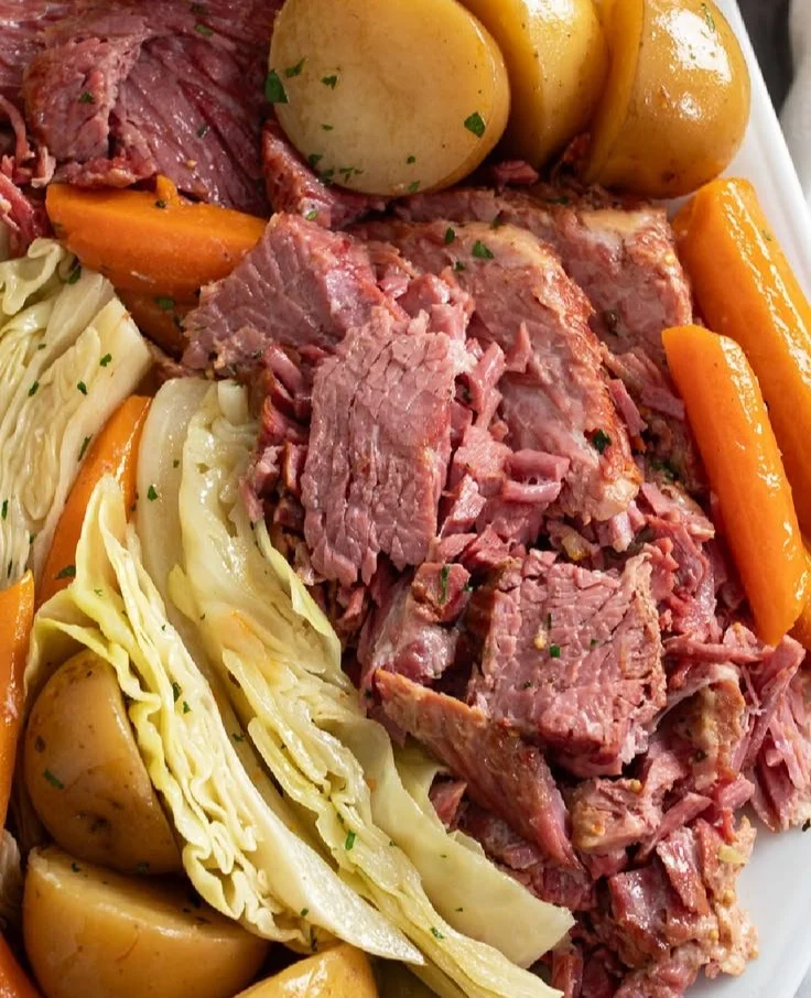 Delicious plate of corned beef and cabbage served with carrots and potatoes