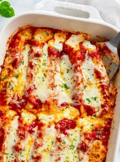 Delicious easy manicotti filled with cheese and topped with marinara sauce