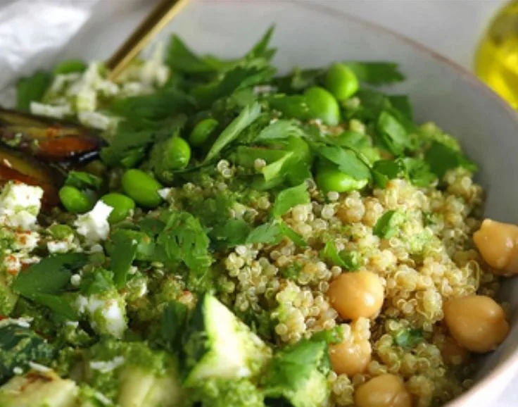 Colorful Green Goddess Quinoa Salad with fresh vegetables and herbs