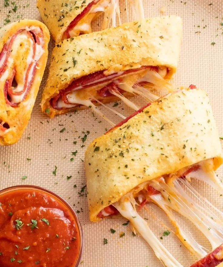 A delicious homemade Stromboli filled with cheese and pepperoni, baked to perfection.