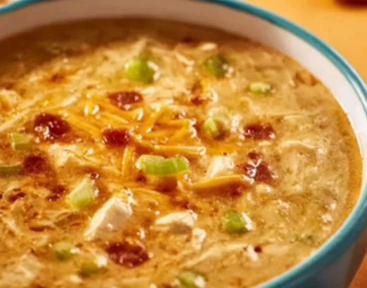 A bowl of delicious Million Dollar Soup garnished with fresh herbs