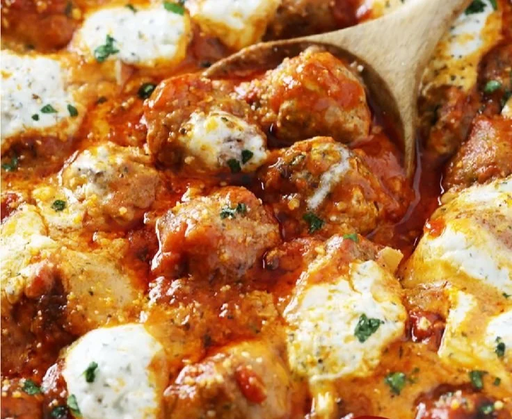 Plate of delicious Ricotta Meatballs garnished with herbs