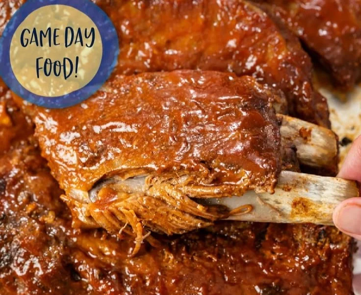 Delicious slow cooker ribs served on a plate with barbecue sauce