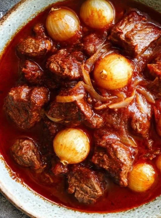 A delicious bowl of hearty stew with vegetables and meat