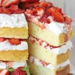 Delicious strawberry shortcake layered with fresh strawberries and whipped cream