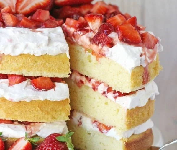 Delicious strawberry shortcake layered with fresh strawberries and whipped cream