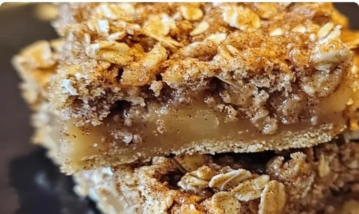 Delicious Cinnamon Pear Oat Squares arranged on a rustic wooden table