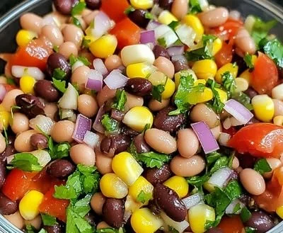 A vibrant bowl of Cowboy Caviar made with 7 delicious ingredients.