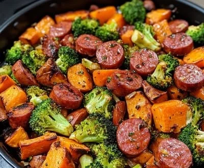 One-pan honey garlic kielbasa with mixed vegetables for a quick dinner.