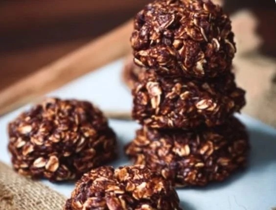 A plate of healthy no bake cookies made with oats, nuts, and chocolate