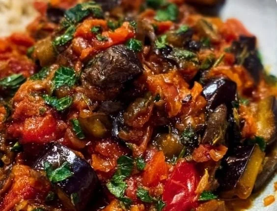 Delicious roasted eggplant caponata served in a rustic dish
