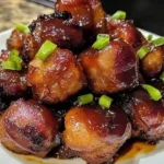 Delicious Honey BBQ Bacon Bombs served on a platter for a party.