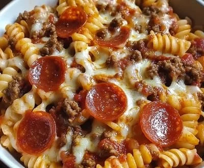Delicious crockpot pizza pasta served in a bowl, perfect for gatherings.