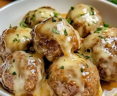 Crock Pot French Onion Meatballs in a delicious sauce served on a plate