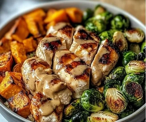 Maple Dijon Chicken Sweet Potato Bowl with vegetables on a wooden table