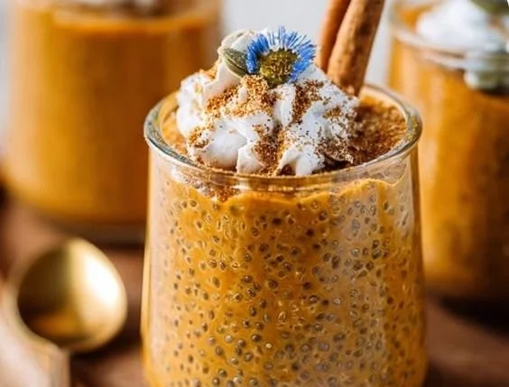 Delicious bowl of creamy pumpkin chia pudding topped with spices and seeds.