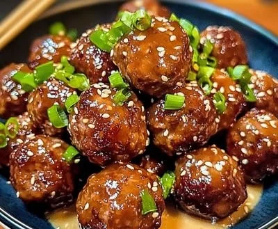 Delicious Korean BBQ meatballs served with a side of dipping sauce