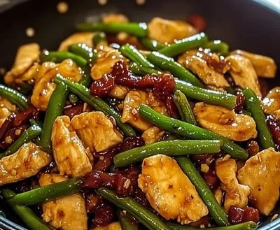 Delicious chicken stir-fry with green beans served in a vibrant dish