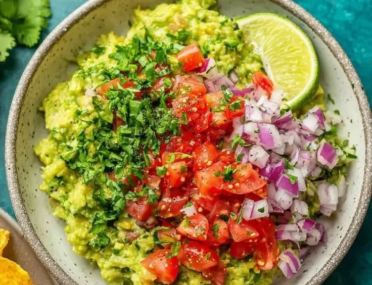 Bowl of authentic guacamole made with ripe avocados and spices