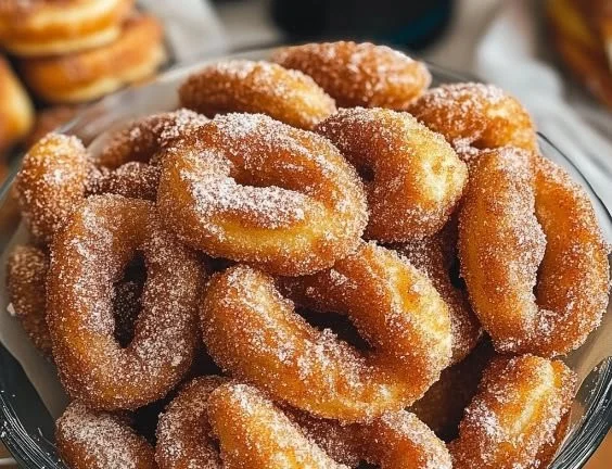 Homemade cinnamon sugar twist donuts on a plate