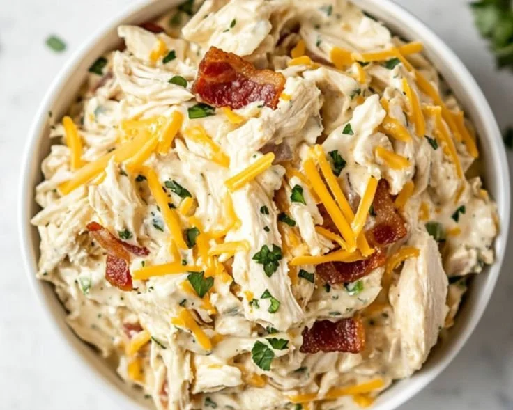Delicious carnivore chicken salad recipe served in a bowl with fresh ingredients.