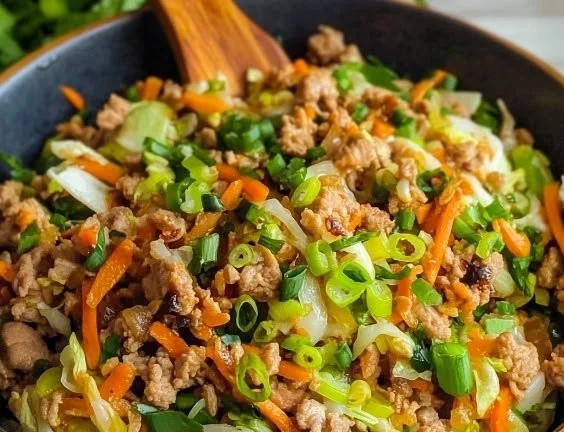 Easy ground turkey egg roll bowls served in a bowl with fresh vegetables