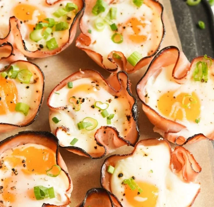 Ham, egg, and cheese muffin cups served on a white plate