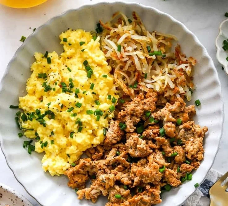High-protein breakfast bowl with eggs, avocado, and quinoa.