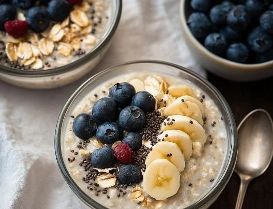 Bowl of high protein overnight oats topped with fresh fruits and nuts