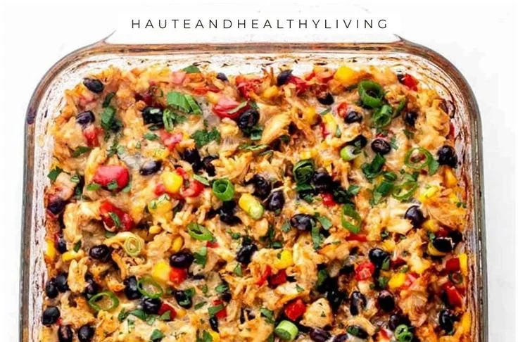 Delicious protein-packed burrito casserole topped with cheese and fresh ingredients.