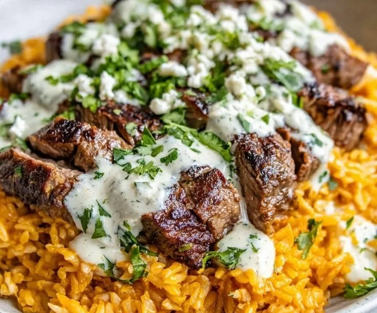 Steak Queso Rice Bowl with tender steak, melted queso, and vibrant vegetables.