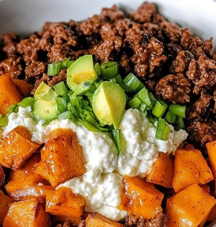Colorful Sweet Potato Beef Bowls with fresh ingredients and spices.
