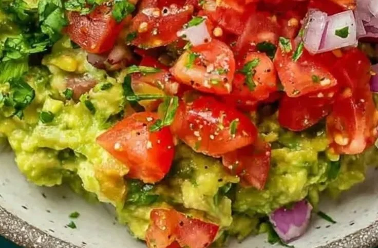Fresh traditional guacamole made with ripe avocados and spices