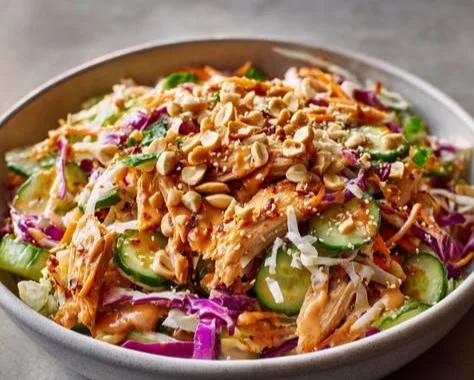 Bang Bang Chicken Salad recipe with vibrant ingredients and high protein content.